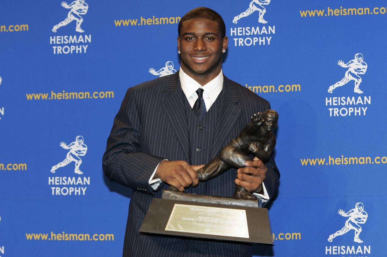 Why did reggie bush get his heisman take